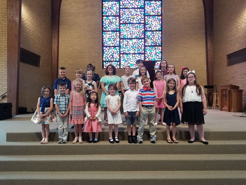 Group of children posing in a church sanctuary